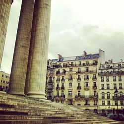 Buildings in city against sky