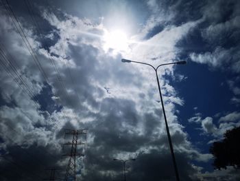 Low angle view of electricity pylon against sky