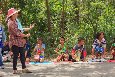 Children playing in forest