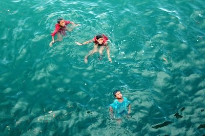 High angle view of man swimming in sea