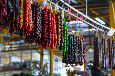 Churchkhela at the bazaar. colored oriental sweets made from nuts and natural juice.