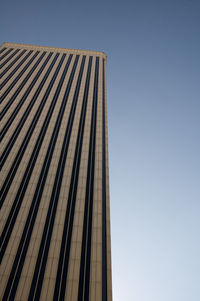 Low angle view of skyscraper against clear sky
