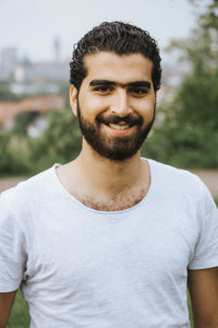 Close-up portrait of smiling young man