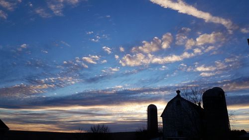 Low angle view of silhouette temple against sky during sunset