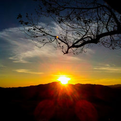 Scenic view of silhouette landscape against sky during sunset