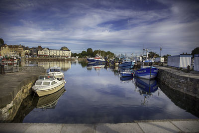 Boats moored in harbor