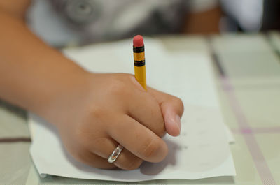 Close-up of hand holding cup