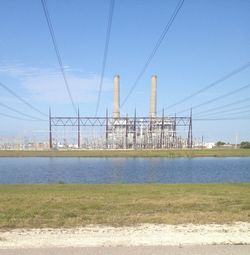 Bridge over river against blue sky