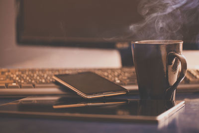 Close-up of coffee cup on table