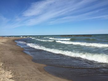 Scenic view of sea against blue sky