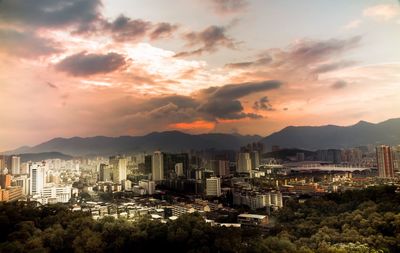 High angle view of city at sunset