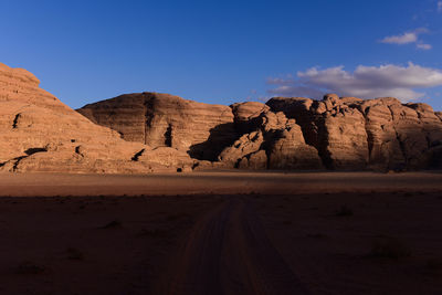 Rock formations in desert against sky