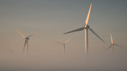 Low angle view of windmill against clear sky