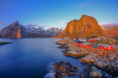 Mountains and lake against blue sky