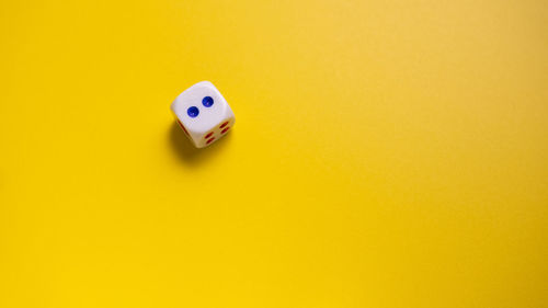 High angle view of toy on yellow background