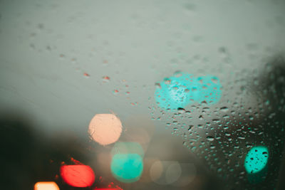 Close-up of raindrops on glass window