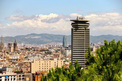 Buildings in city against sky