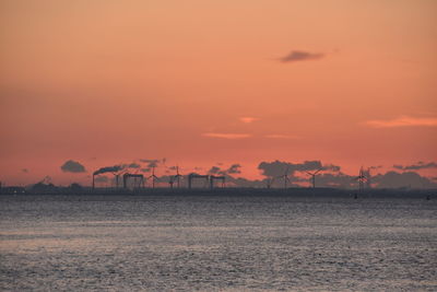 Scenic view of sea against romantic sky at sunset