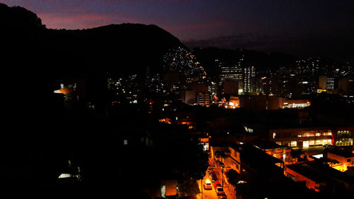 High angle view of illuminated buildings in city at night