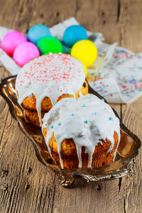 Close-up of desserts on wooden table