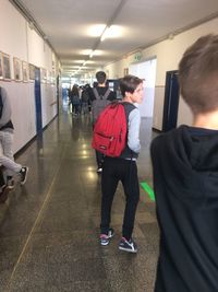 Women standing in corridor of building