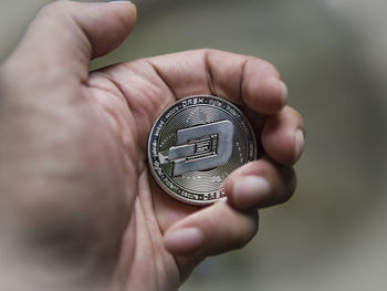 Close-up of hand holding ring