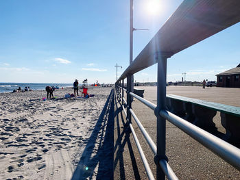 People on beach against sky