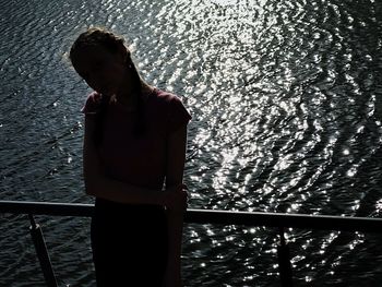 Midsection of man standing in water