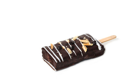 Close-up of chocolate cake against white background