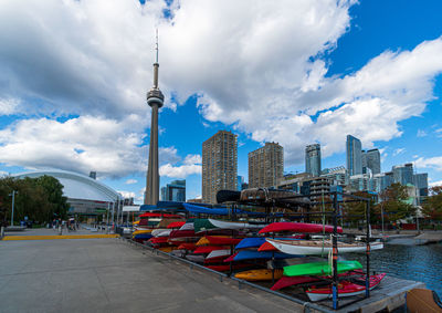 Panoramic view of buildings against cloudy sky