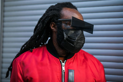 Stylish african man in black mask and glasses
