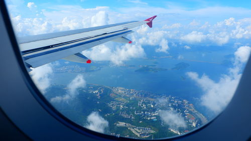 Aerial view of city seen through airplane window