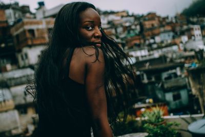 Close-up of young woman in city