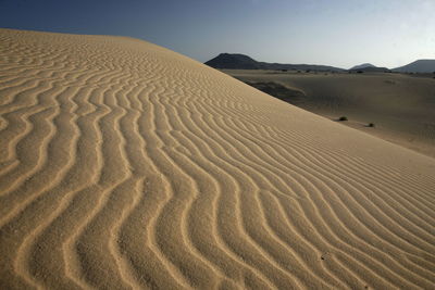 Scenic view of desert against clear sky