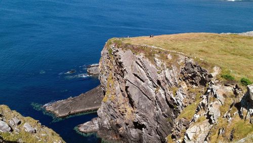 High angle view of cliff by sea