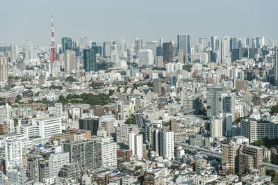 Aerial view of modern buildings in city against sky