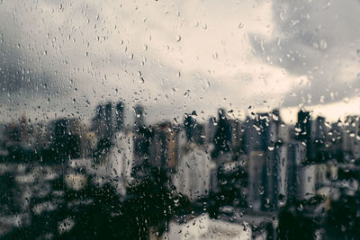Full frame shot of wet glass window during rainy season