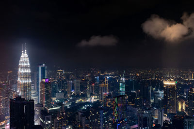 Illuminated buildings in city at night