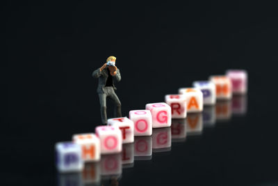 Candles on table against black background