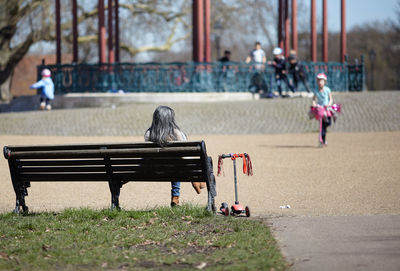 People sitting on bench in park