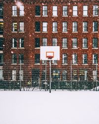 Text on brick wall in winter