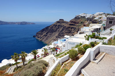 High angle view of road by sea against clear sky