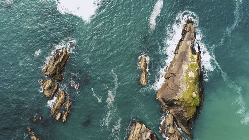 High angle view of rock formation in sea