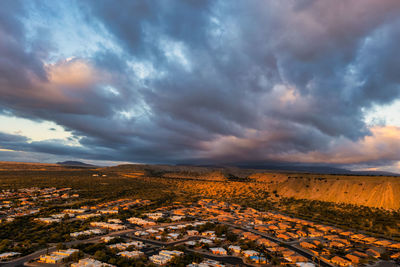 Green valley, arizona retirement community, aerial view at sunrise with dramatic clouds