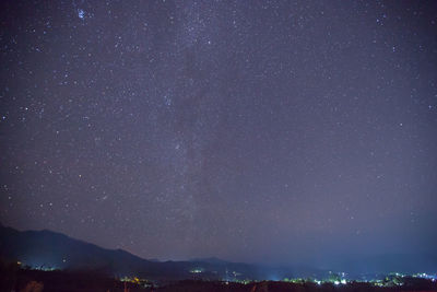 Scenic view of star field against sky at night