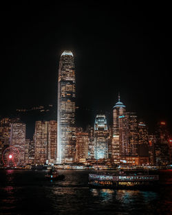 Illuminated buildings in city at night