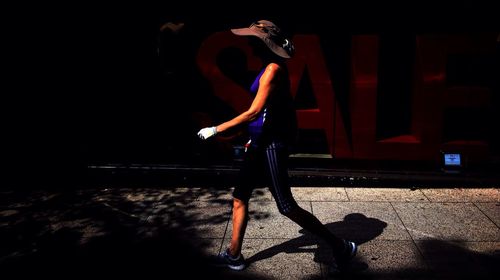 Full length of woman standing in pond