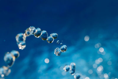 Close-up of bubbles against sea