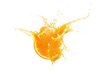 Close-up of water drops on orange against white background