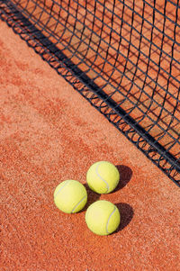 High angle view of balls on tennis court